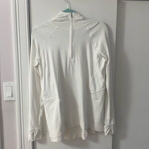Lululemon woman’s size 8 zip up hoodie, color white, with pockets.
